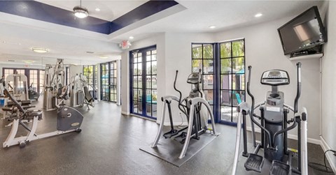 Fitness center with cardio equipment at Midora at Woodmont in Tamarac, FL